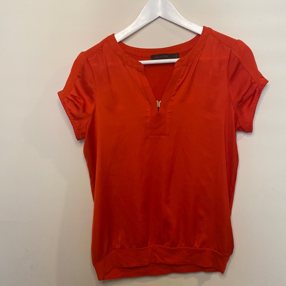 The limited Size XS extra small bright red/orange short sleeved top with clasp.